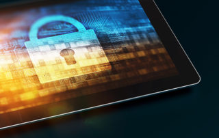 A touchscreen tablet with a lock and computer code showing on the screen