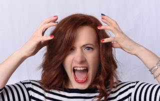 A woman shouting in frustration