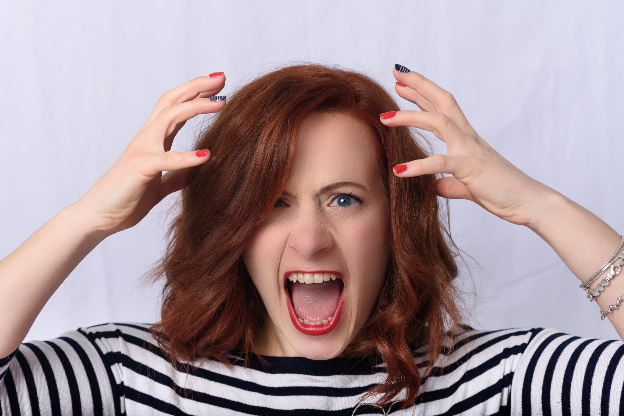 A woman shouting in frustration